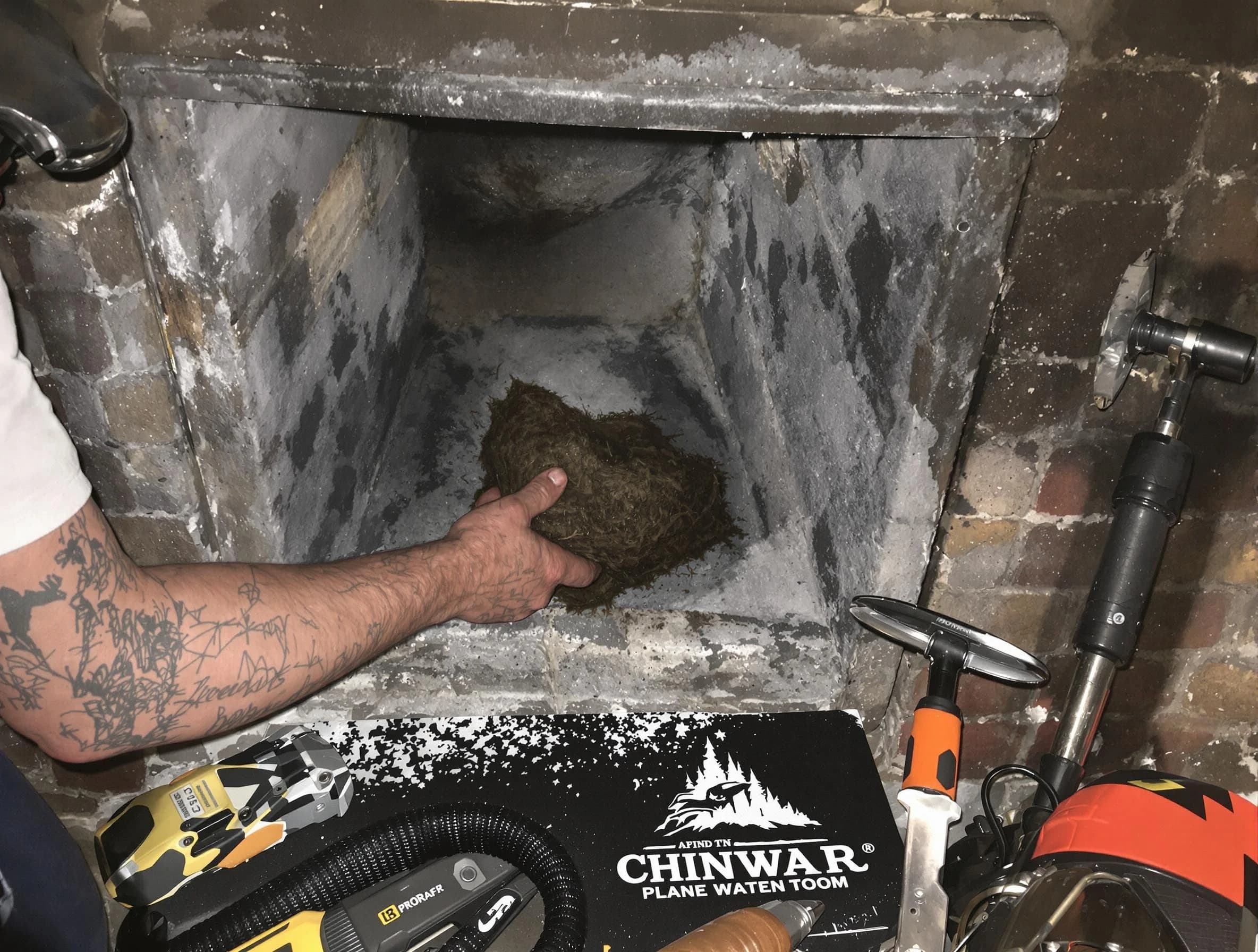 Worcester Chimney Sweep safely removing debris and screening chimney in Worcester, MA
